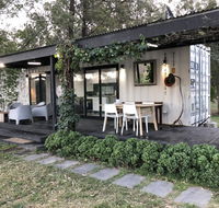 Absolute riverfront shipping container cabin - Australian Destinations
